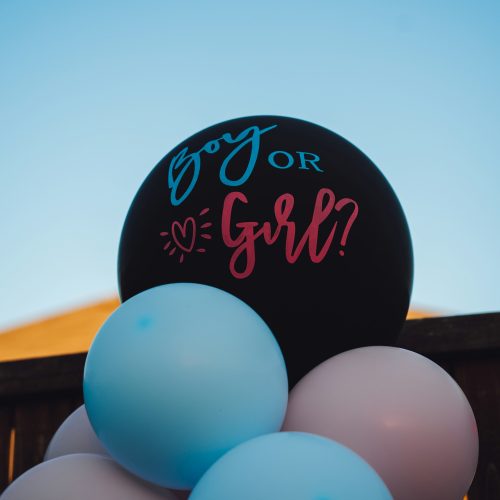 Gender reveal party in Phuket with confetti cannon and themed dessert table