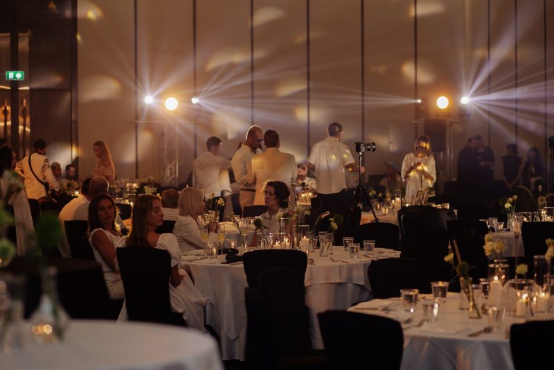 Elegant corporate gala dinner in Phuket ballroom with candlelit tables
