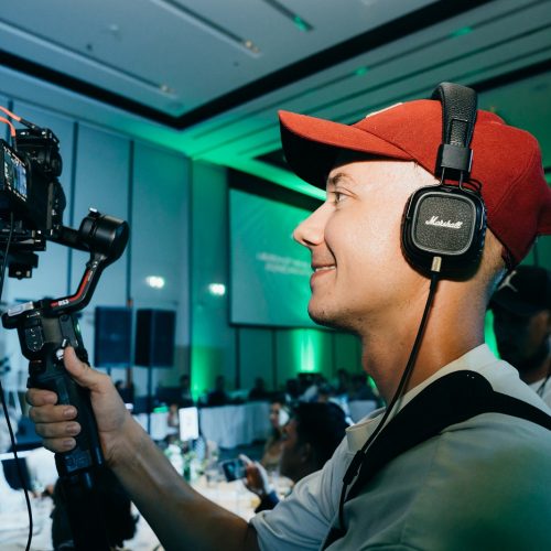 Video production crew in Phuket filming event with gimbal and drone